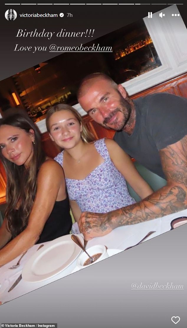 Family: Victoria looked fabulous in a black tank top as she posed for a photo with daughter Harper and husband David