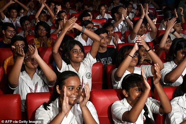 Students celebrate while watching the livestream of the launch of the PSLV XL rocket with the Aditya-L1 spacecraft