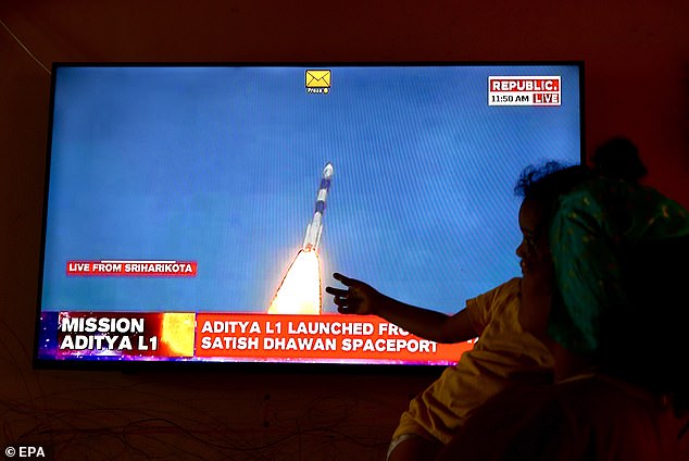 A television recording showing Indian women watching the Space Research Organization's live coverage showing Aditya L1 payloads rocketing from a launch pad at the Satish Dhawan Space Center in Sriharikota