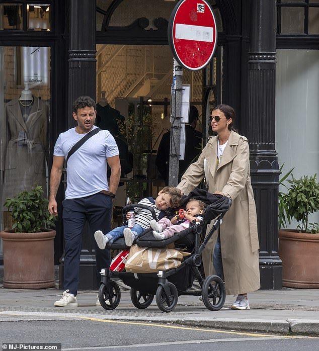 Family: Lucy pushed three-year-old Roman and 16-month-old Lilah in a double buggy full of Zara shopping bags