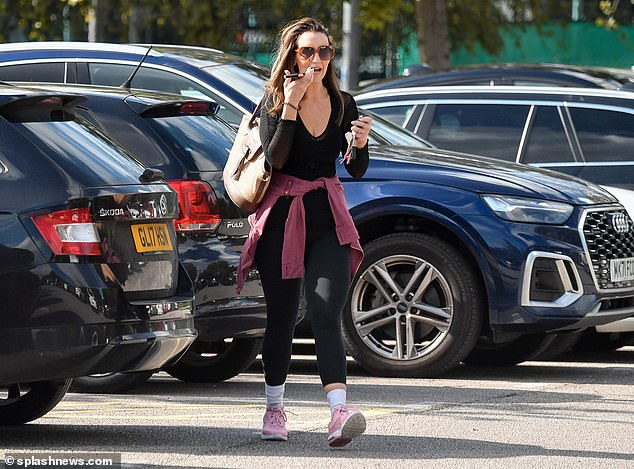 No glamor today: The soap star, who played Eva Price in the ITV soap, added pink trainers and white socks, shielding her eyes with oversized orange sunglasses