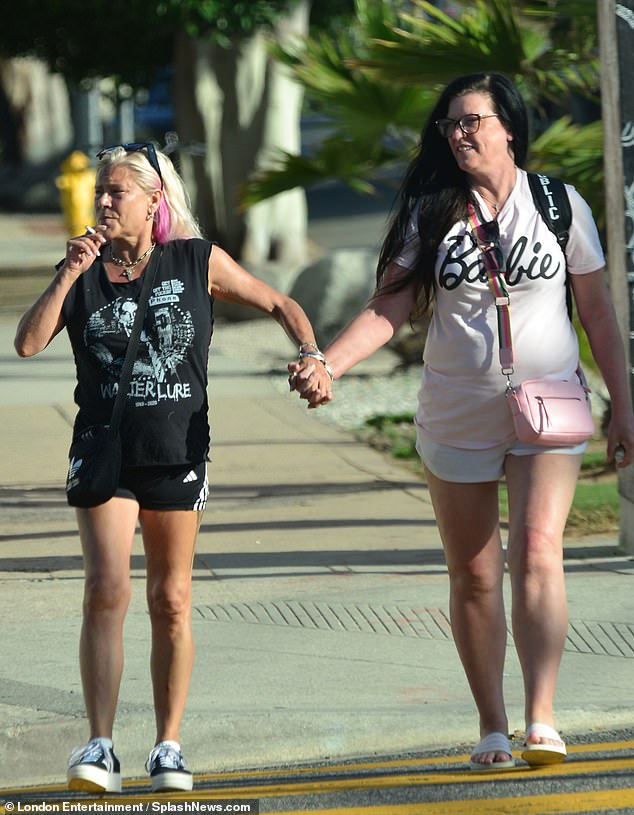 Sun-kissed: The former model wore a black graphic print T-shirt and Adidas gym shorts as she reached Venice Beach in Santa Monica