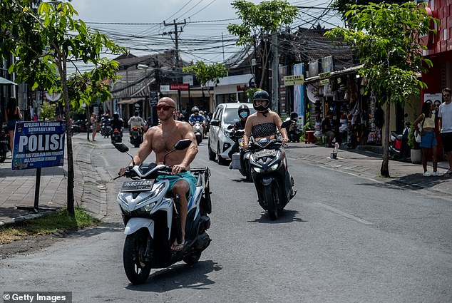 Bali also wants to ban foreign tourists from traveling around the island on motorcycles after a spate of injuries and deaths (pictured in Canggu, Bali)