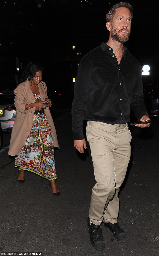 Smart casual: Calvin dressed in beige chinos and opted to wear sneakers for the wedding party