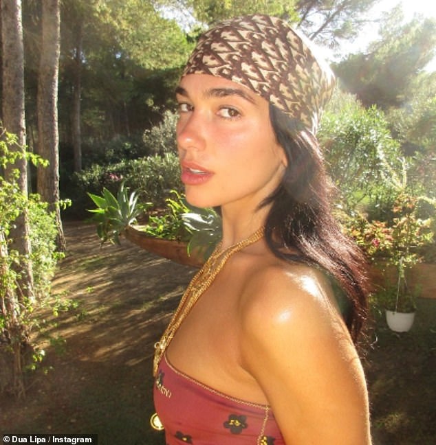 Posing: Dua, who celebrated her 28th birthday in Ibiza, showed off her natural beauty as she appeared to be wearing makeup free in the dewy outdoor photo