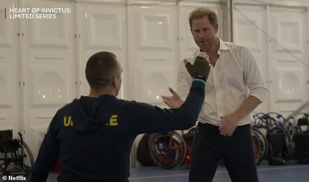 The Duke of Sussex gives a veteran a high five during the new Netflix documentary Heart of Invictus