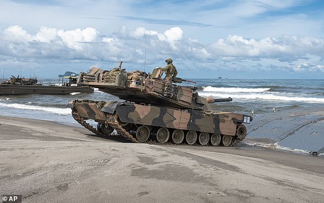 An Australian Army M1A1 Abrams Main Battle Tank of the 2nd Cavalry Regiment lands on the beach during a large-scale combined amphibious assault exercise Friday, August 25, 2023 at a naval base in San Antonio, Zambales, Philippines