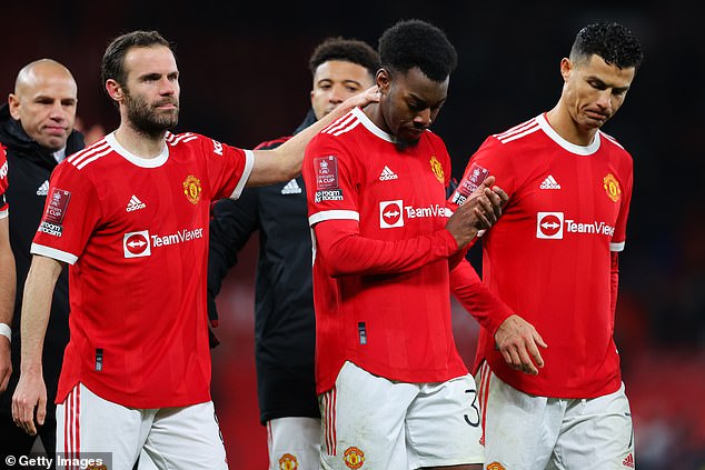 Manchester United's Juan Mata and Cristiano Ronaldo comfort Anthony Elanga after missing a penalty during the Emirates FA Cup fourth round match against Middlesborough