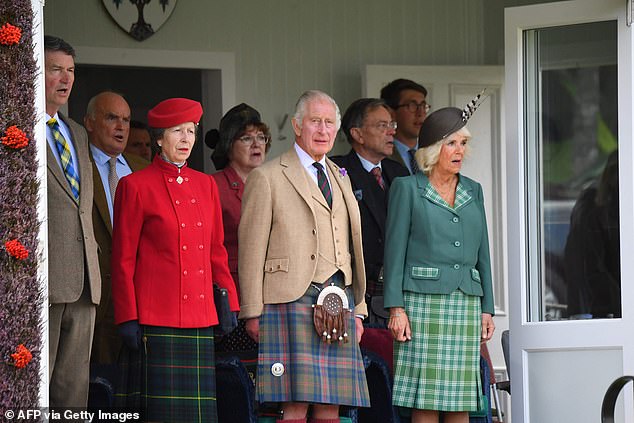 Vice Admiral Timothy Laurence (left), Britain's King Charles III (center), Britain's Queen Camilla (right) and Britain's Princess Anne, Princess Royal (third from left) attend the annual Braemar Gathering in Braemar