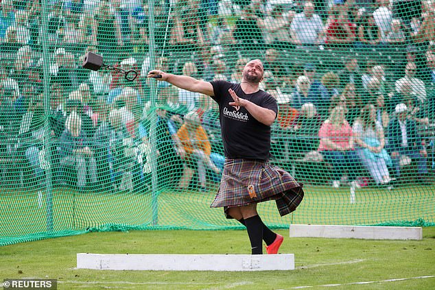 A man takes part in the Braemar Royal Highland Gathering at the Princess Royal and Duke of Fife Memorial Park in Braemar