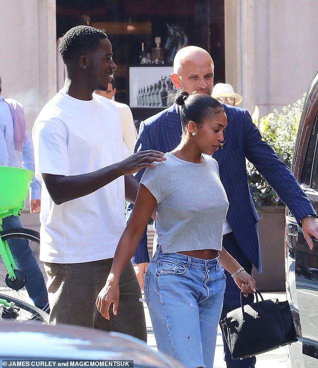 Chilled: Loris seemed happy and relaxed as she walked into a nearby waiting car