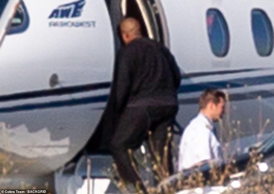 Private flight: Kanye, 46, was seen boarding a private jet in Italy on Friday