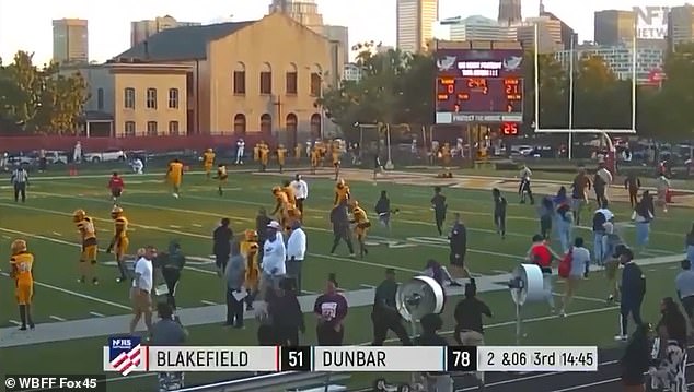 There were scenes of chaos as panicked players and spectators run away from the Baltimore bleachers and across the football field as several shots rang out.