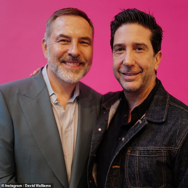 Brave: David smiled next to Friends star David Schwimmer who opted for a dark denim jacket that he wore over a black unbuttoned shirt