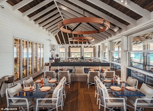 Prices at Comporta's new beach club JNCQUOI aren't cheap, with a lobster and truffle mayo hot dog for $42 (€39) and a crab cocktail entree for $48 (€45).