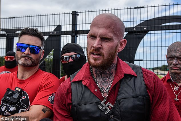 Christopher "Hammer" Pohlhaus (pictured center right) leads a meeting with neo-Nazi groups Blood Tribe and Goyim Defense League