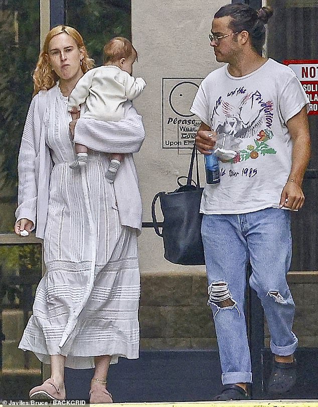 The 35-year-old actress was photographed holding her newborn daughter Louetta as she exited an office building with her partner Derek Thomas.