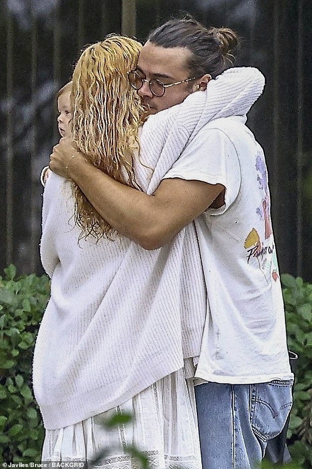 Sweet: At one point during the outing, the couple stopped to share a warm hug before taking a break