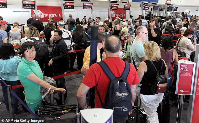 Passengers line up at Virgin Austr Australian airline Qantas took the drastic step in 2011 to ground its entire fleet indefinitely amid an escalating labor dispute