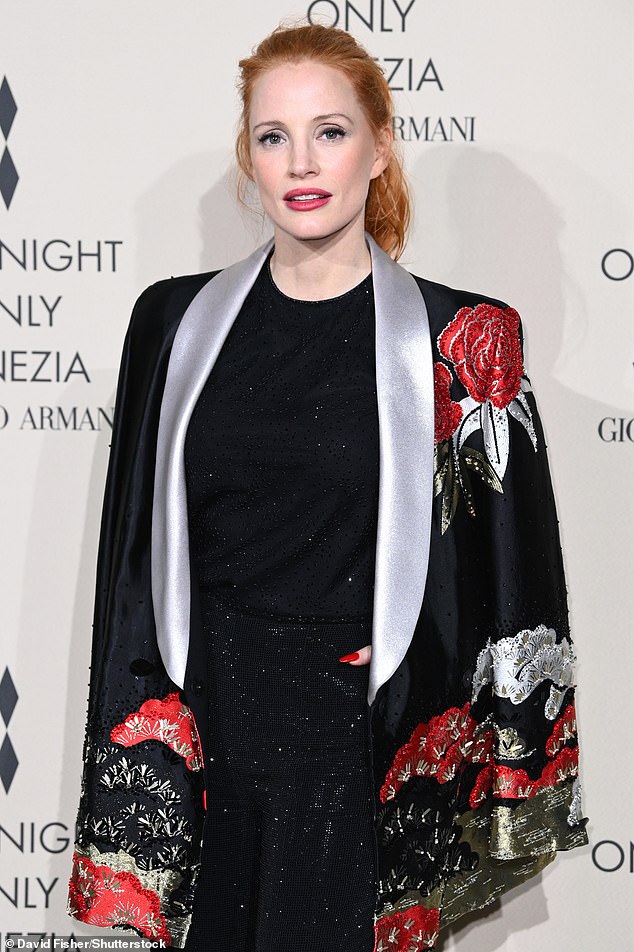 Details: For the occasion, Chastain delighted in a black sleeveless top which she tucked into a pair of high-waisted trousers adorned with black crystals