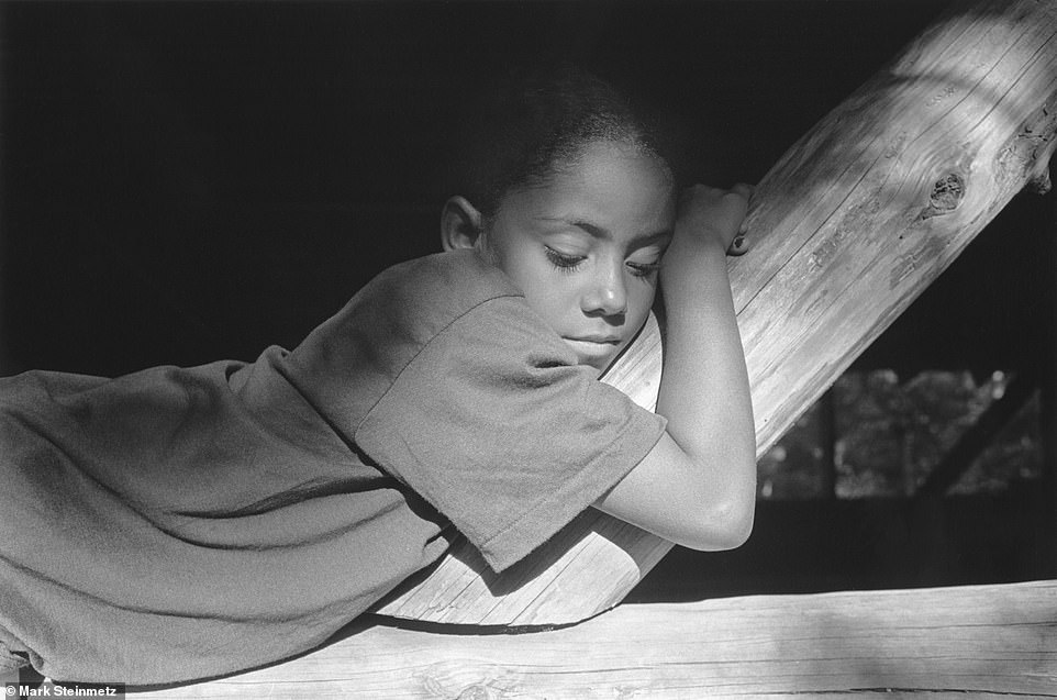 A young girl watched as she took a moment to rest her eyes