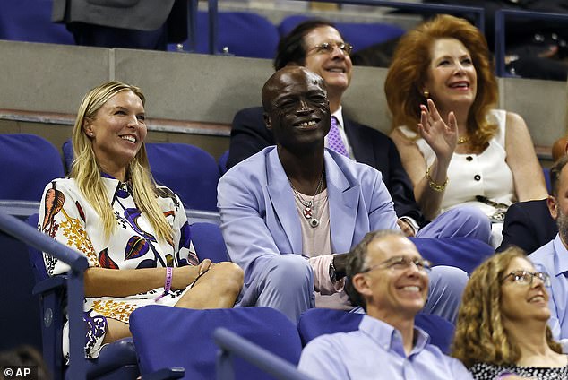 Sweet: Seal (born Seal Henry Olusegun Olumide Adeola Samuel) seemed happy and relaxed as he enjoyed the tournament with Laura