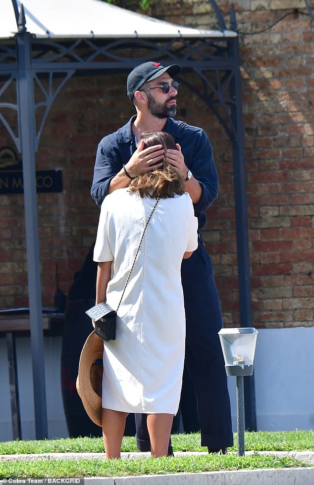 PDA: The actress, 37, showed off her trendy sense of style in the midi dress, paired with black sandals and a Chanel crossbody bag