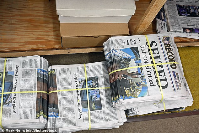 Bundles of copies of this week's edition are piled on the floor behind the reception desk in the paper's office