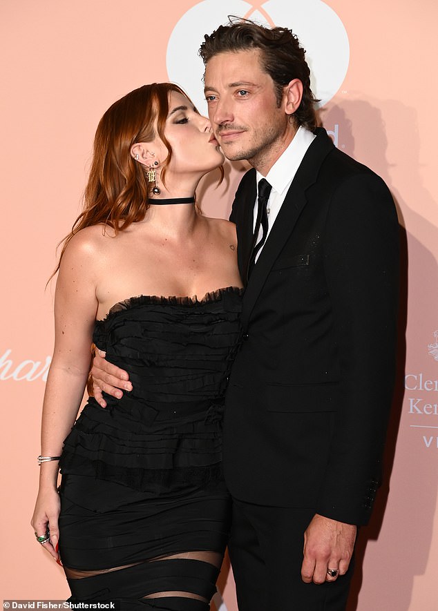 Kiss: The duo couldn't keep their hands off each other and grabbed the PDA as they headed to the star-studded red carpet