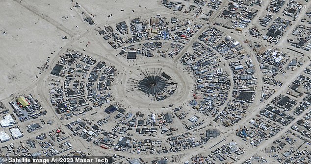 This satellite image courtesy of Maxar Technology shows an overview of the annual Burning Man Festival taking place in Nevada's Black Rock Desert on August 29, 2023 - before the rain