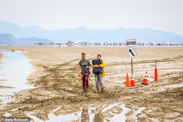 Burning Man attendees try to leave the festival in Nevada's Black Rock Desert