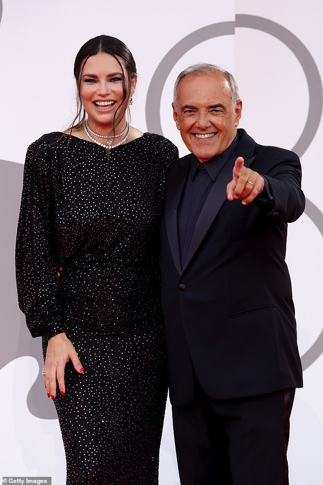 Dynamic duo: Adriana was also captured posing alongside the president of the Venice Film Festival and famed film critic Alberto Barbera – as the duo looked happy on the red carpet