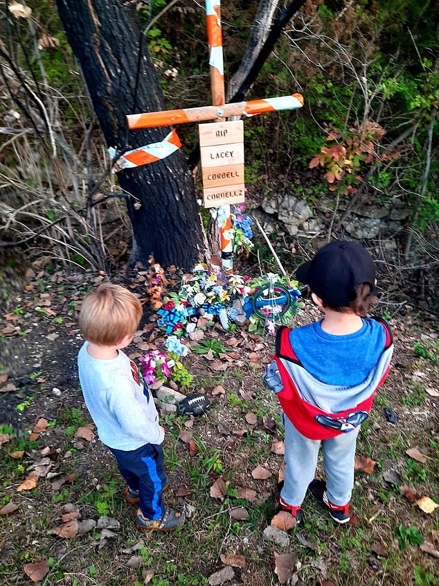 Bentley, five, and Mason, three, visit the scene of their parents and siblings' accident