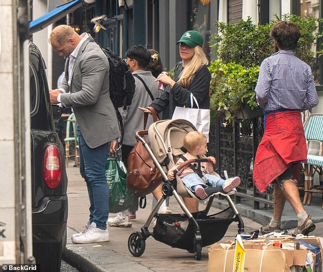 Brave: James looked good in a light gray blazer jacket as he pulled on blue skinny jeans