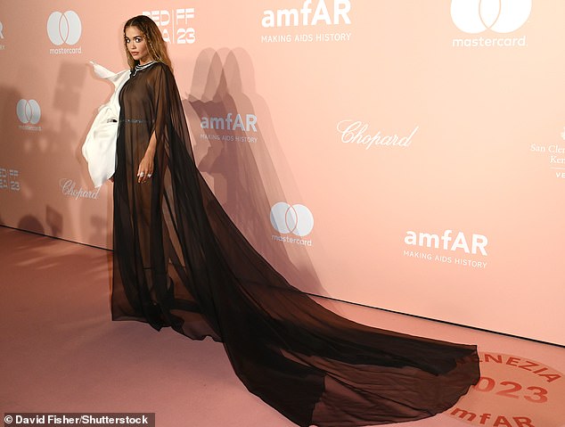 Glamor Factor: The gorgeous dress also featured a long dramatic train