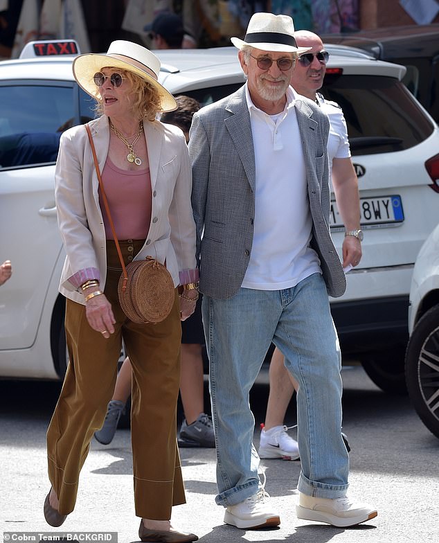 The film director beamed as he walked the streets of Portofino, a former fishing port, holding hands with retired American actress Capshaw