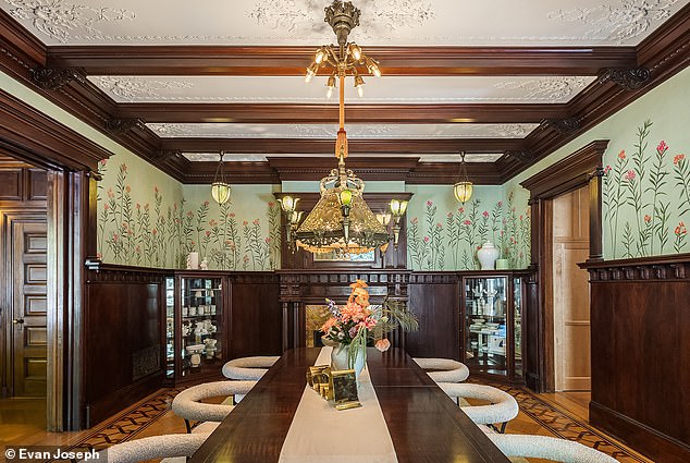 The kitchen opens into a large dining room with a huge fireplace