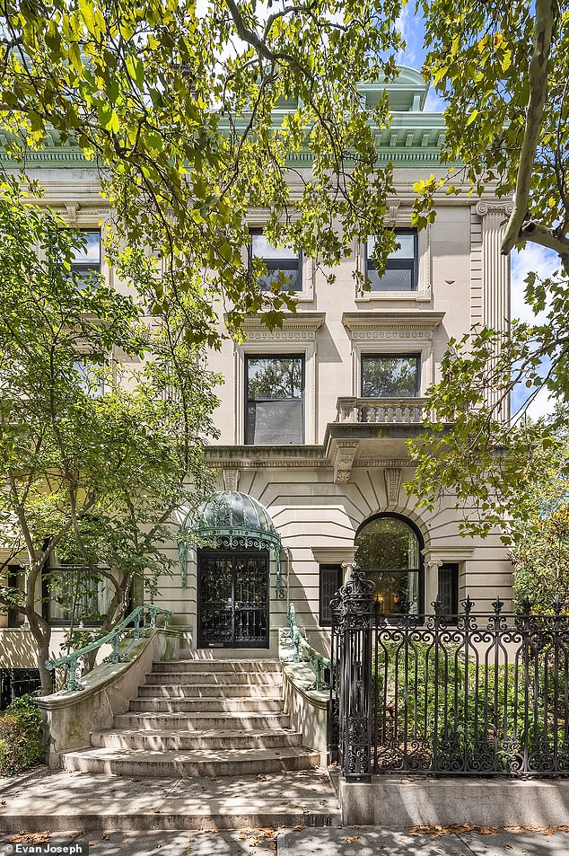 The house is complete with a stark white limestone facade and a courtyard garden at the back - a rarity in New York City