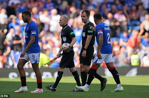 Rangers star James Tavernier protested along with referee Don Robertson as they left at half-time