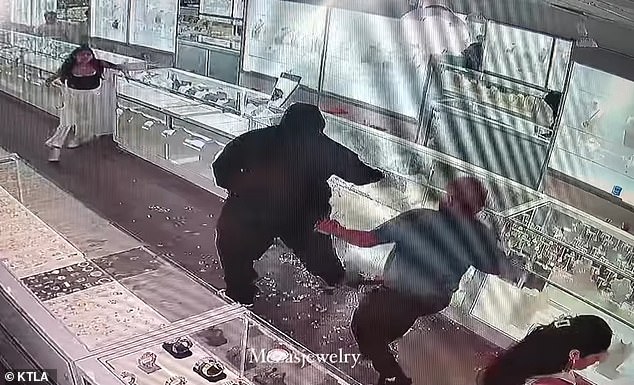 This photo shows the moment when one of the store employees fights back