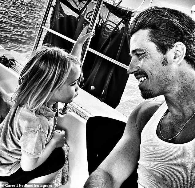 On the water: In the snaps, the 38-year-old artist enjoyed the company of his two-year-old only child as they spent time together on a boat while celebrating his birthday