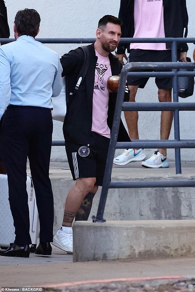 Chilled: Messi looked relaxed as he stepped outside before the game