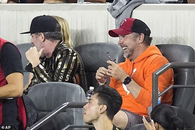 Relaxed fit: Ted Lasso star Jason Sudeikis, 47, rocked an orange hoodie and red-and-black hat to the event