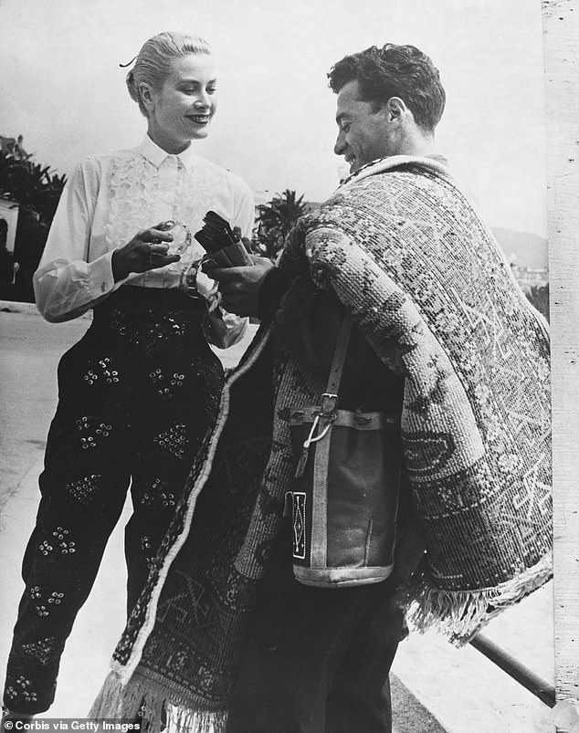 Grace pictured at the 1955 Cannes Film Festival where she first met Rainier.  Here she talks to a peddler by the sea