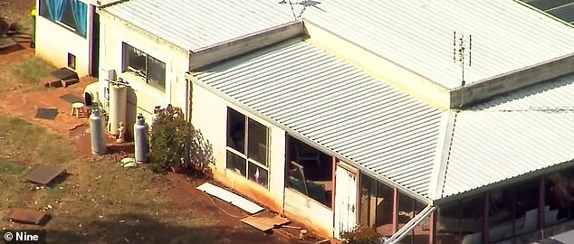 The 64-year-old woman was in the kitchen of her rural home (pictured) in East Nanango, Queensland, when the ceiling suddenly gave way on Monday.