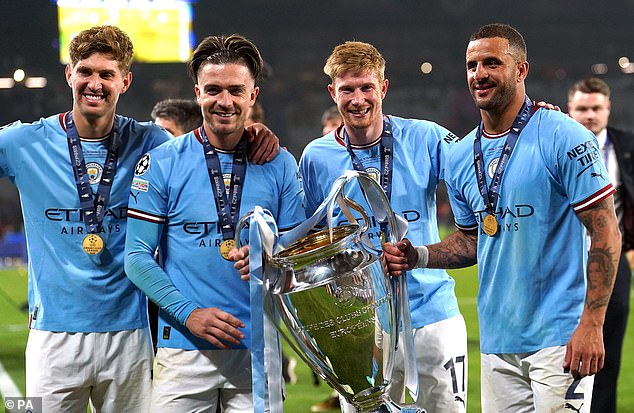 Walker (right) won the treble with City last season and is aiming for more silverware