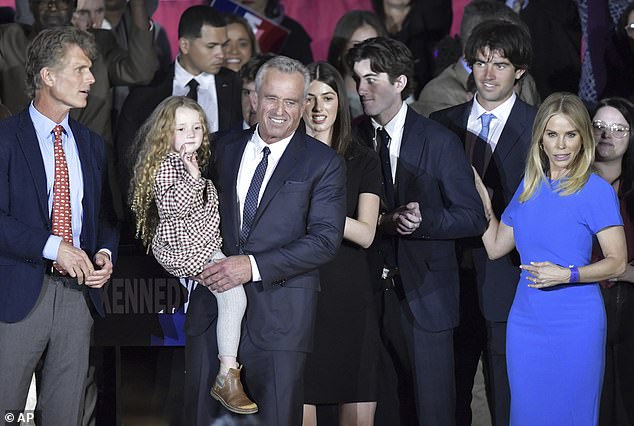 The four-aged Bobcat joined Hines and two sons of RFK Jr, Aidan and Finn, with his cousin Anthony Shriver (far left) also on stage