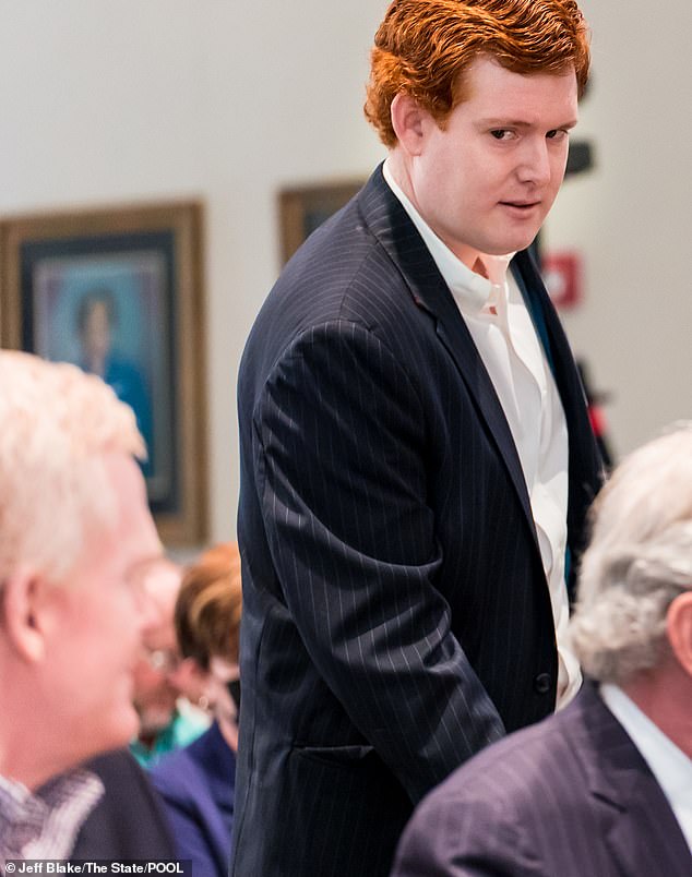 Buster has insisted on his father's innocence.  He exchanges a glance with the convicted killer as he walks to the witness stand at the Colleton County Courthouse in Walterboro in February 2023.