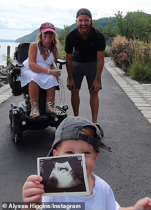 Alyssa posted a video of her two-year-old son Luke running towards the camera with an ultrasound scan in his hand as she and her husband, Jimmy, 32, looked on in admiration