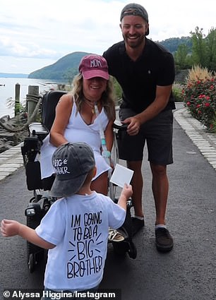 Alyssa posted a video of her two-year-old son Luke running towards the camera with an ultrasound scan in his hand as she and her husband, Jimmy, 32, looked on in admiration